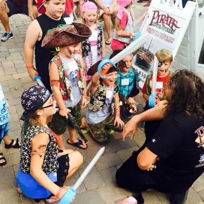 A group of kids excited to be dressed up as pirate