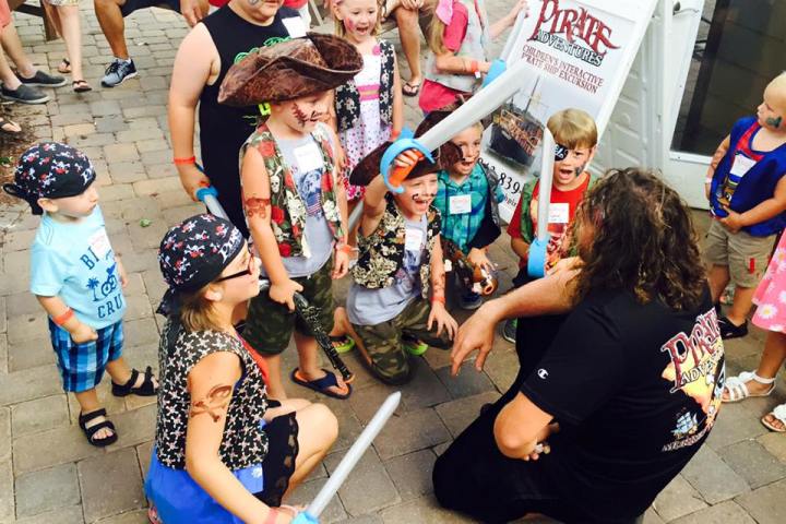 A group of kids excited to be dressed up as pirate