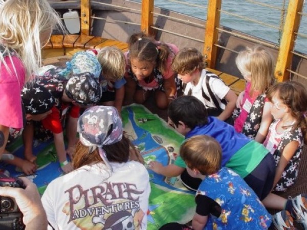 A group of kids looking at a map